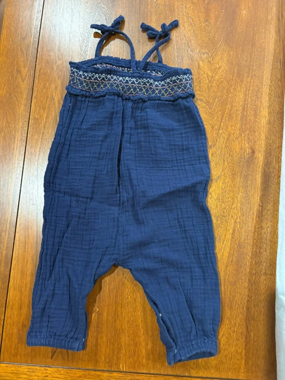 Old Navy navy romper with smocking, ties, snaps, size 12-18 months